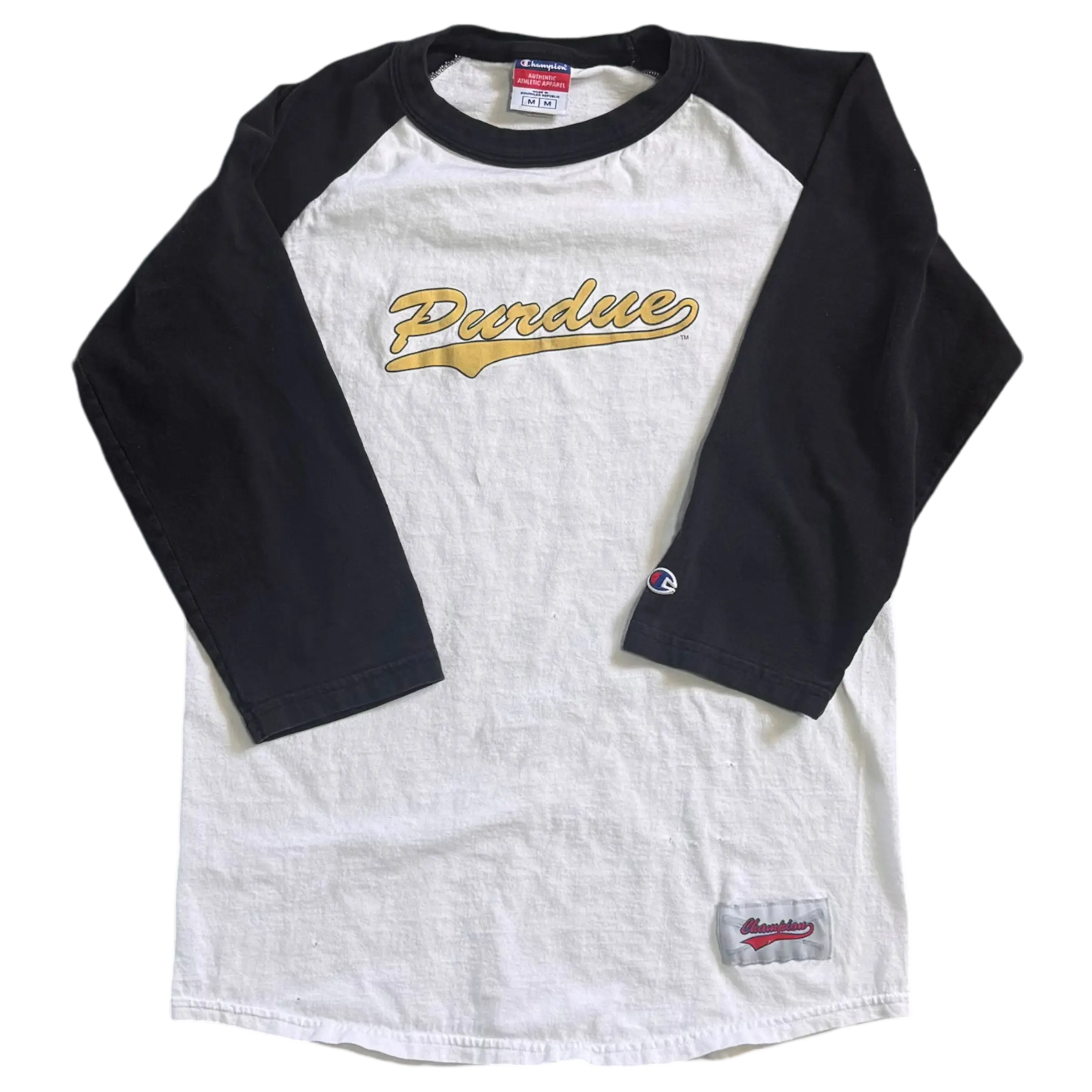 Vintage Purdue 3/4 sleeve tee with a white body and black sleeves, featuring a bold script logo on the front. Perfect for Purdue fans and vintage apparel collectors.